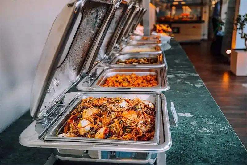 Hot chafing line set up for an office lunch in Maitland, Florida